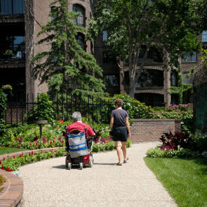 woman walking with disabled person