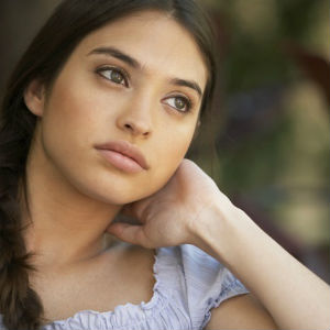 woman with hand on her neck