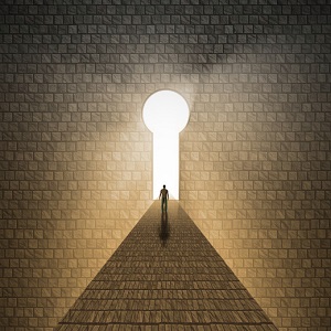 illuminated keyhole at the end of a hallway