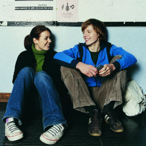 young man and woman laughing