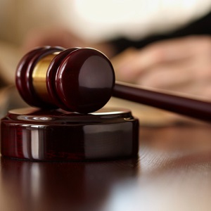 judge with gavel in courtroom