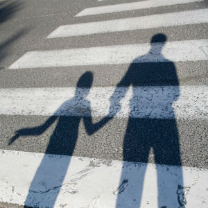 shadow of parent holding hand of child