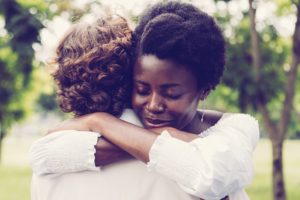 Woman hugging her friend