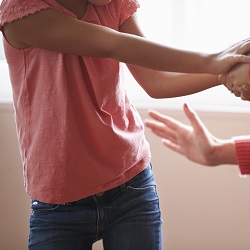 Parent's hand spanks child