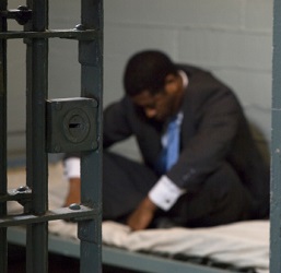 African-American man in prison cell