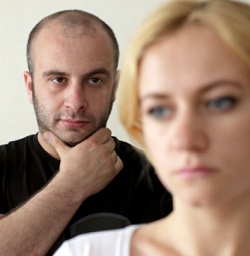 Man watches woman from behind