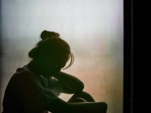 Silhouette of girl grieving