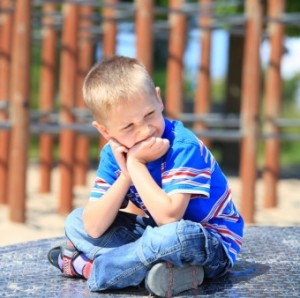 thoughtful child on playground