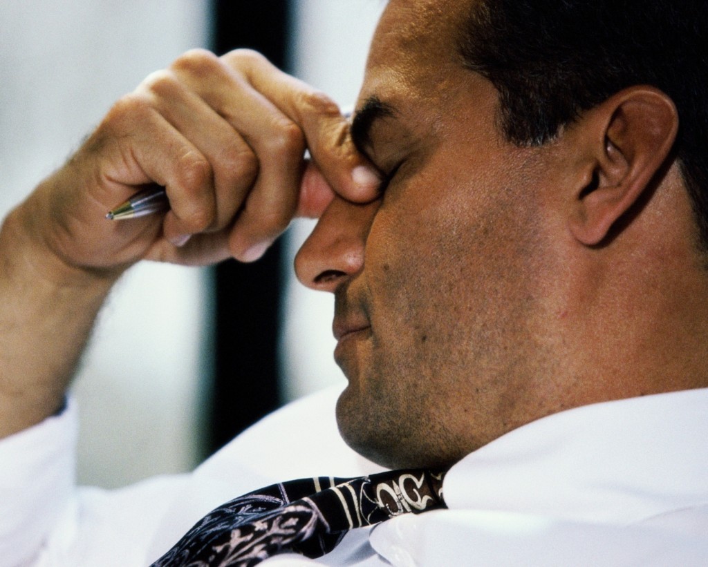 Business man with eyes shut