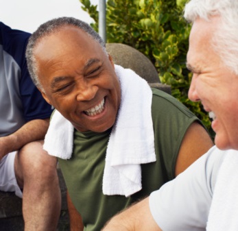 Senior men laugh after a workout
