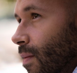 portrait of young bearded man with pensive expression