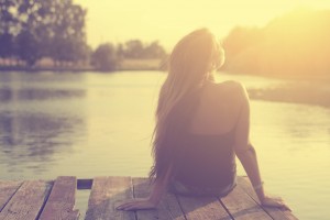 Vintage photo of relaxing young woman in nature