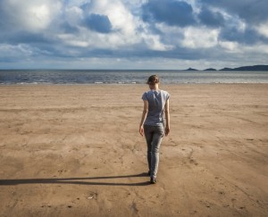 Woman Walking Towards the Sea
