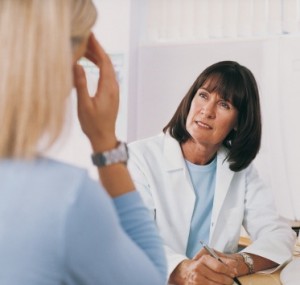 Doctor Listening to Patient Talk About Her Medical Symptoms