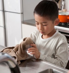 child doing dishes