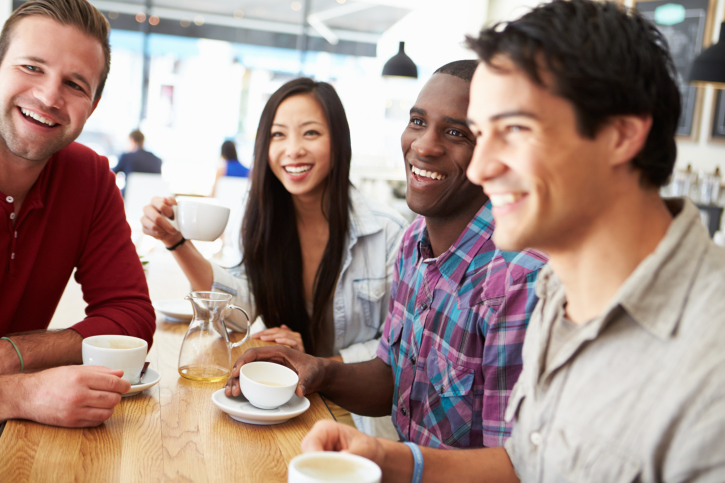 One woman and three men meet for coffee