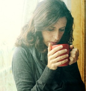 Woman holding cup of coffee