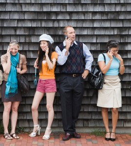 Group of friends using phones