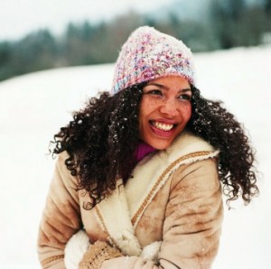 Portrait of a Young Woman Wearing a Hat in the Snow