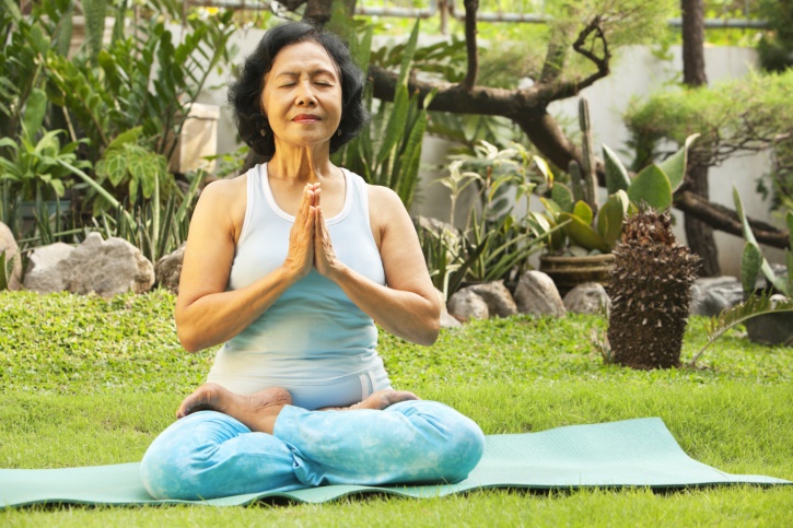 aging woman meditating