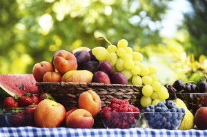 Basket of fresh organic fruits in the garden