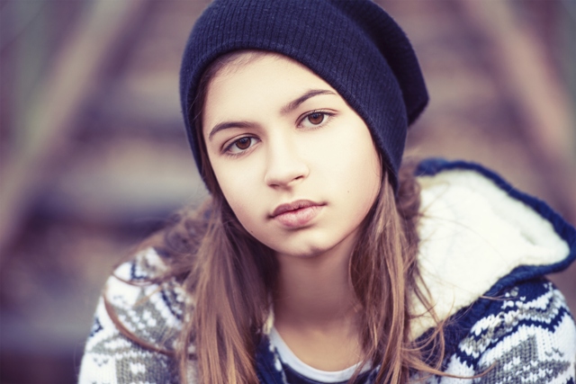  teenage girl in hat outdoors