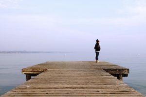 Woman Standing on a Dock