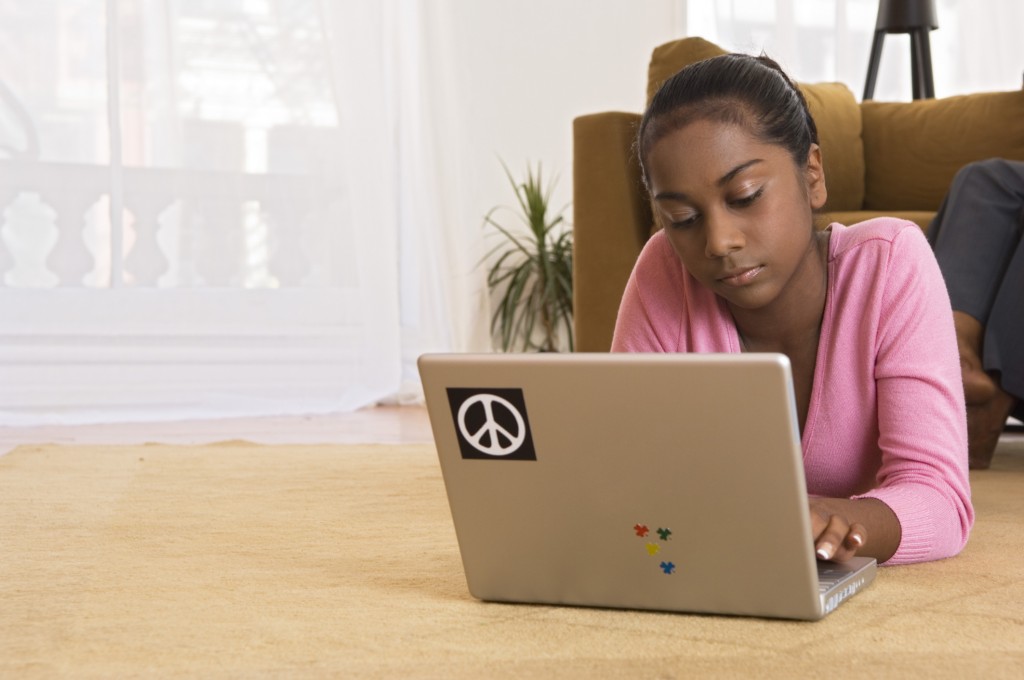 Teenage girl with laptop