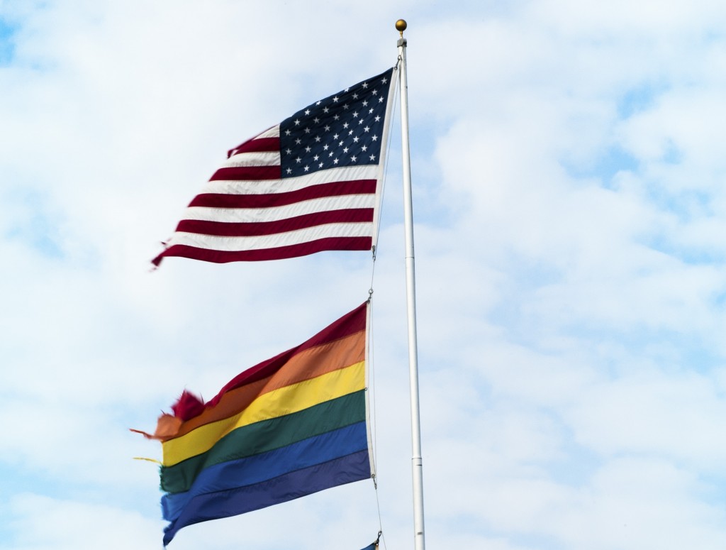 A flagpole displaying an American flag and an LGBT equality flag