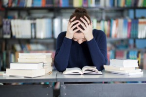 Female student overwhelmed with homework