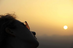 Woman in sunglasses at sunset