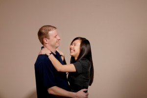 A man and woman embracing and laughing