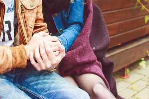 Couple hugging and holding hands