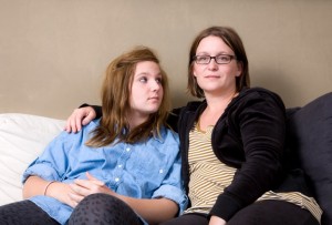 mother with arm around daughter