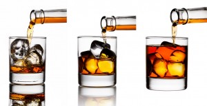 pouring more whiskey drink