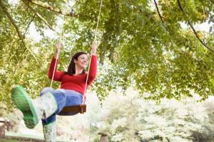 Young woman on swing