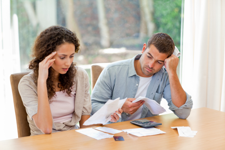 A Young couple calculates their finances together