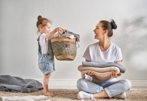 Child helping mother with chores