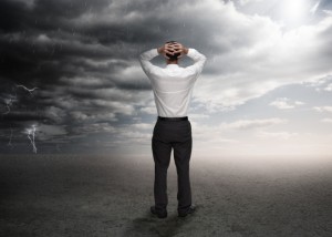 Businessman standing in a desert