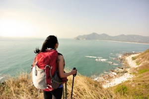 hiking woman seaside moutain peak enjoy the view