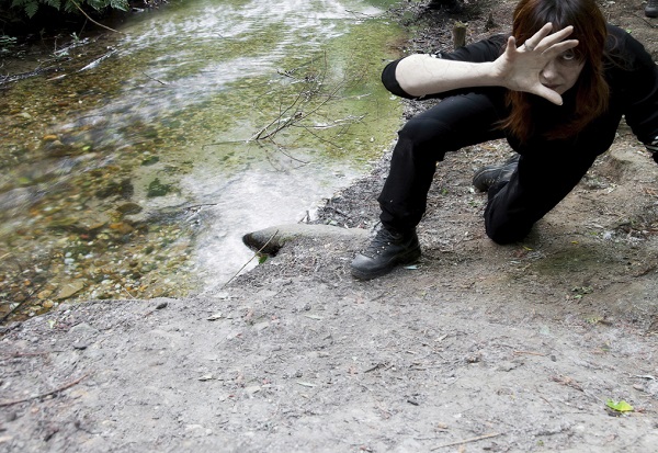 zombie crouching in forest