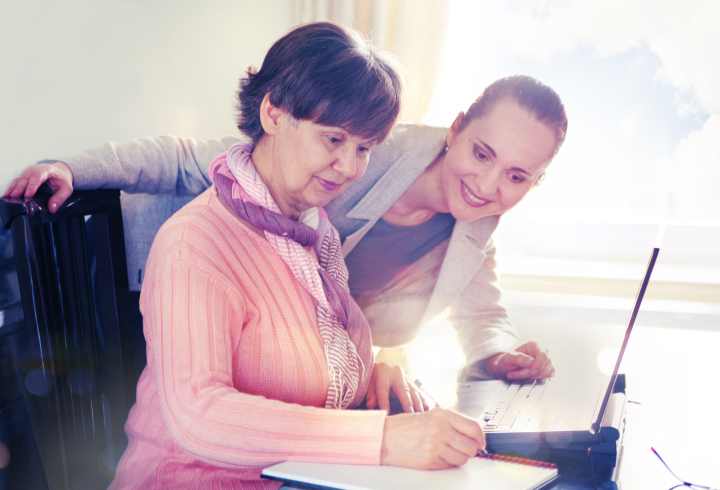 Young woman and older woman working together