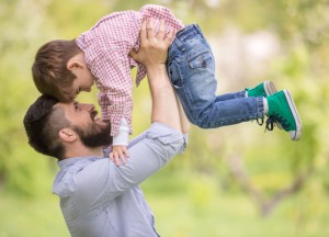 Father and son playing