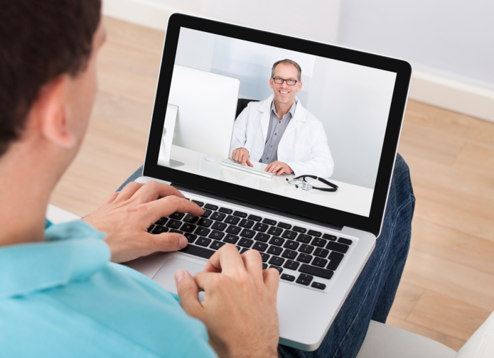 Man talking to therapist over video chat