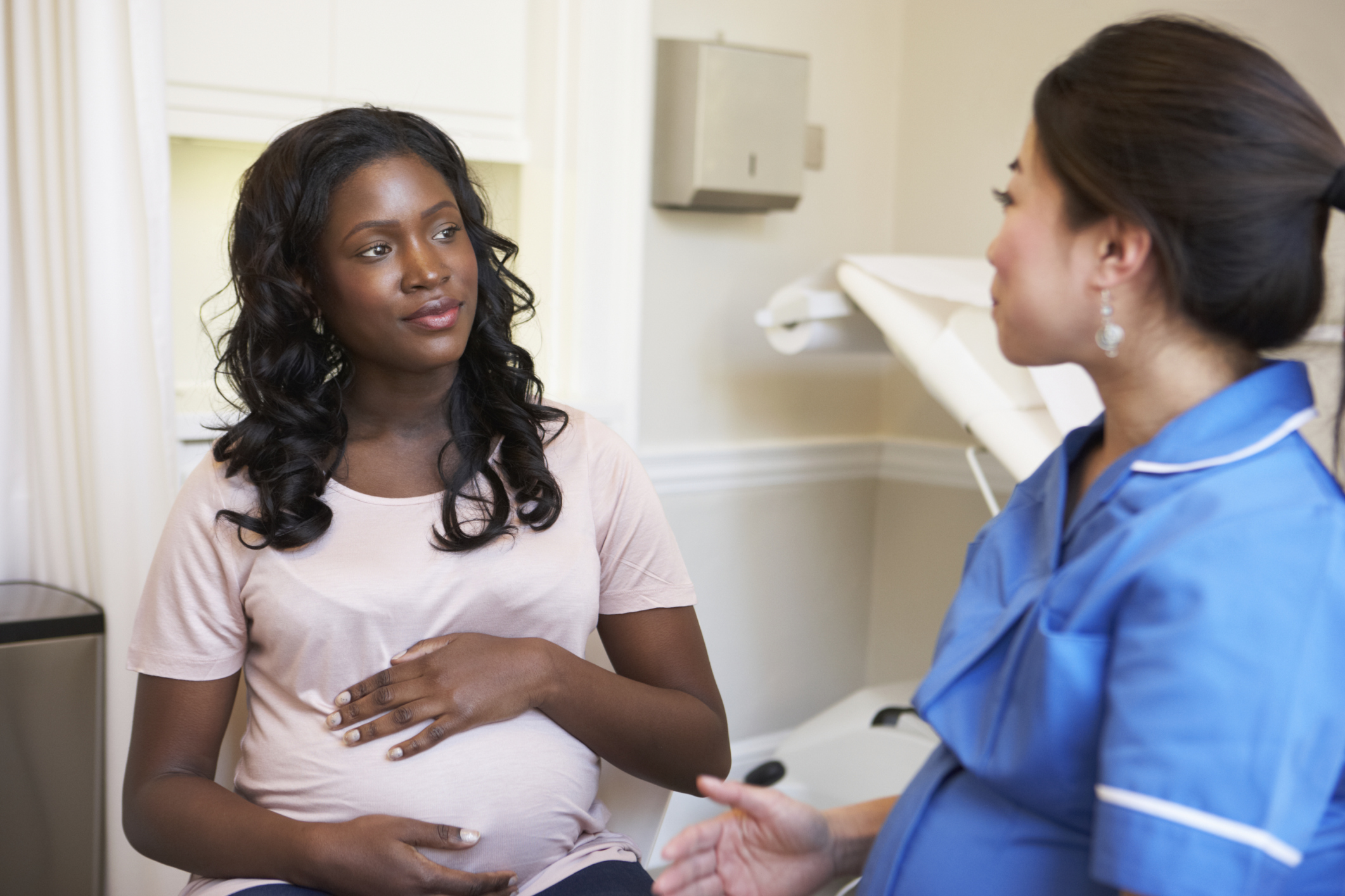Pregnant woman meeting with a nurse