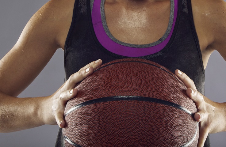 Portrait of female basketball player in studio