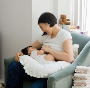 A woman breastfeeding an infant
