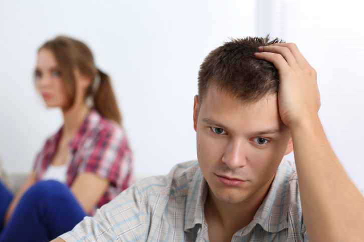 Portrait of unhappy young couple having problems