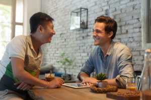 Two Men Sitting at Cafe