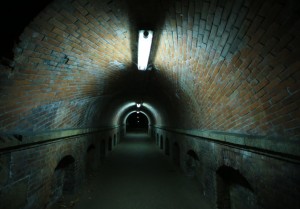Underground tunnel with water on the road
